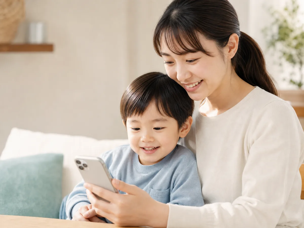 Parent and child checking a notice on a smartphone